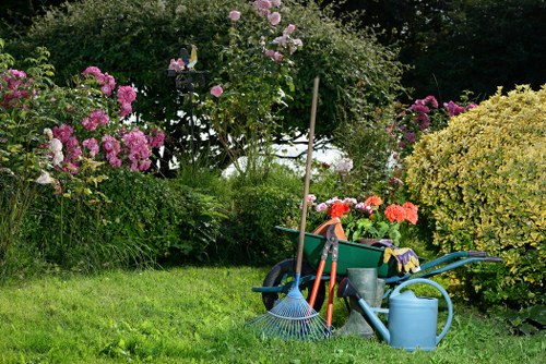 Gardening team assessing a front garden in Raynes Park