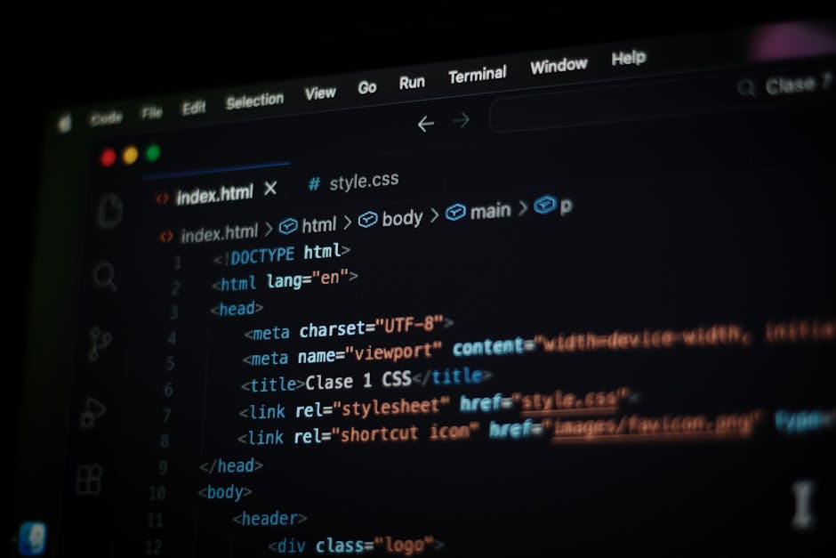 A close-up view of a computer screen displaying HTML code in a dark-themed code editor. The lines of code include tags such as <html>, <head>, <title>, and <link>, along with attributes like charset a