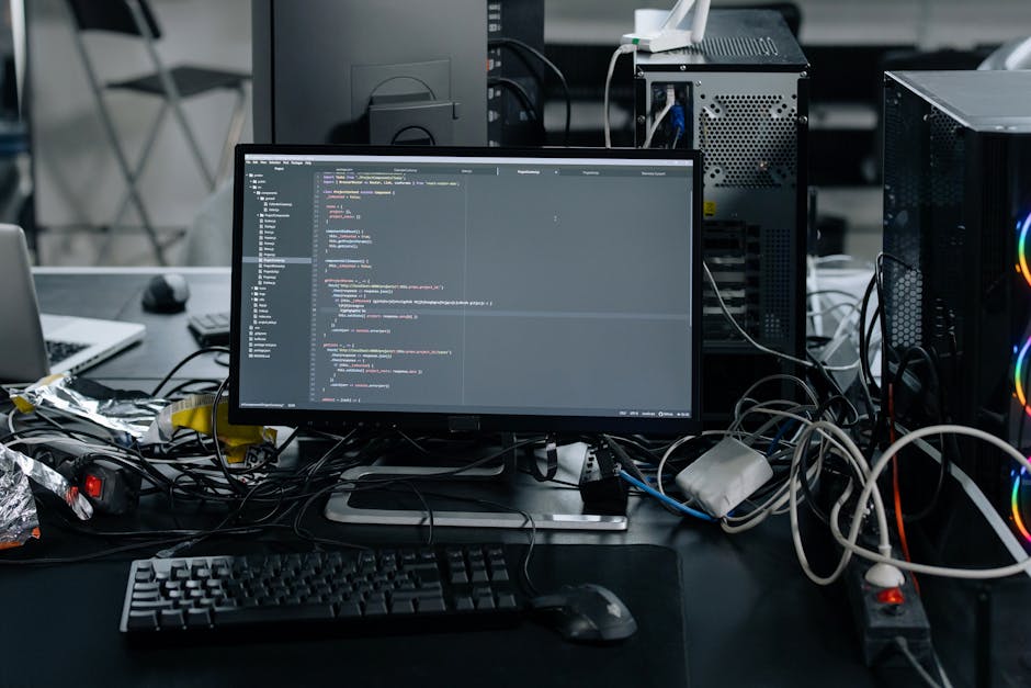 A close-up view of a computer screen displaying HTML code in a dark-themed code editor. The lines of code include tags such as <html>, <head>, <title>, and <link>, along with attributes like charset a